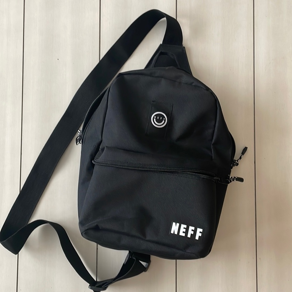 Small sling black bag.